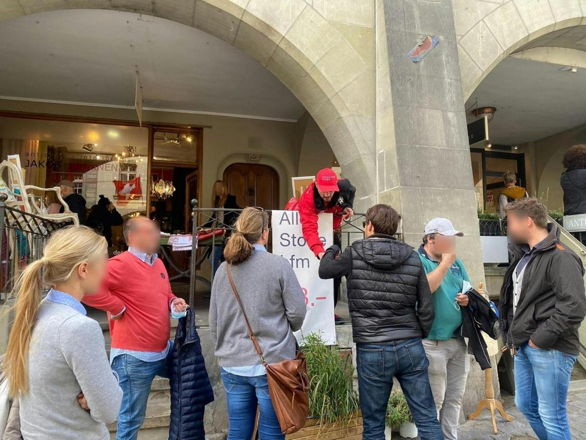 a group of people standing outside of a building