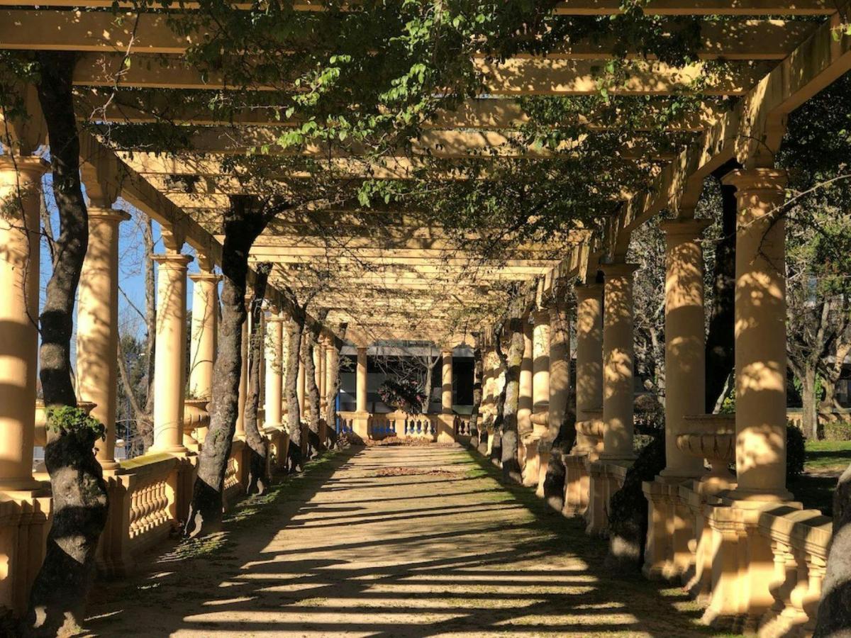 an old building with columns and a walkway