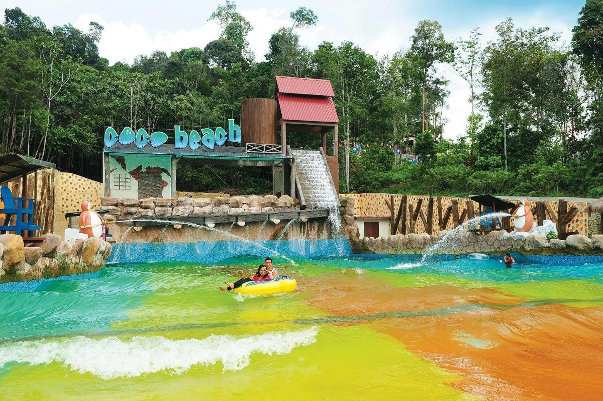 a person in a raft in a water park