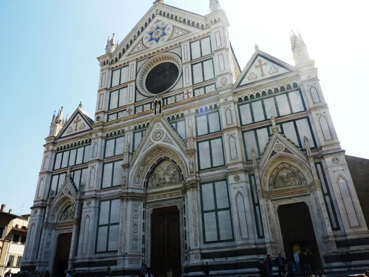 a large white building with a clock on it