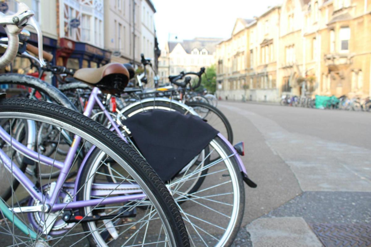 a group of bikes parked on the side of a street