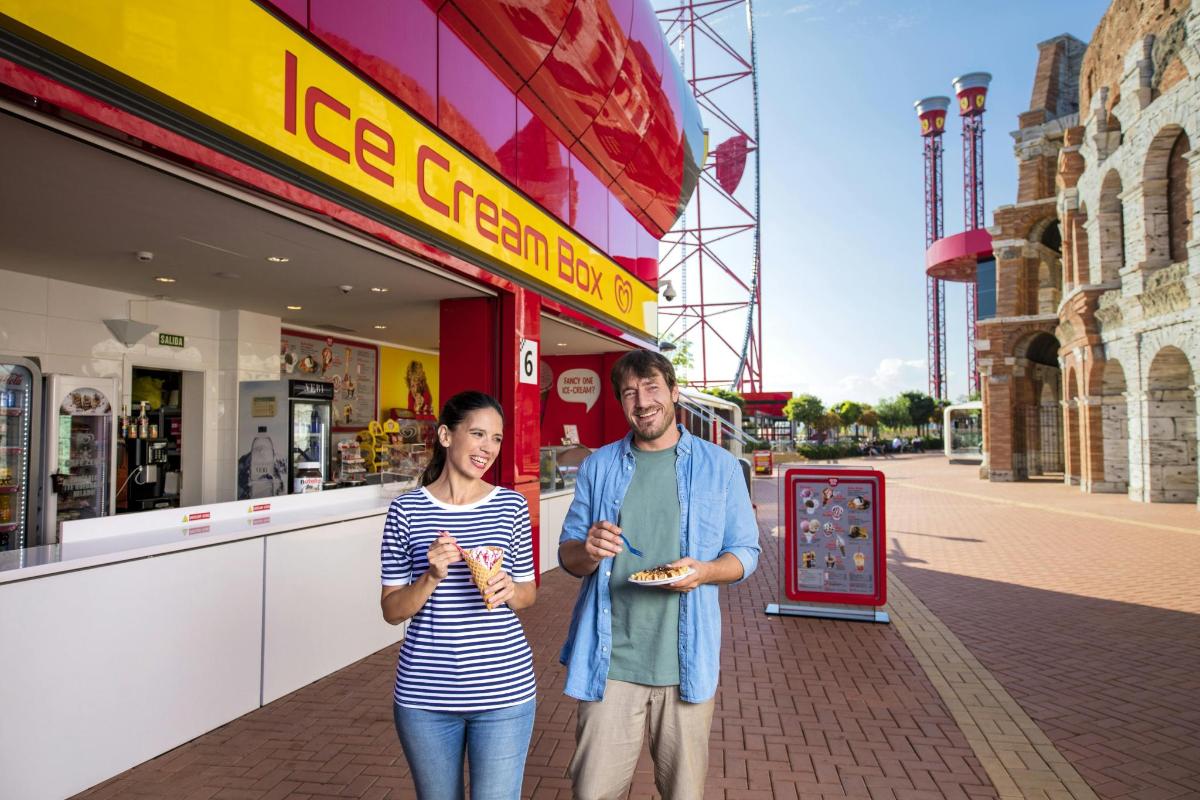 a man and a woman standing in front of a store