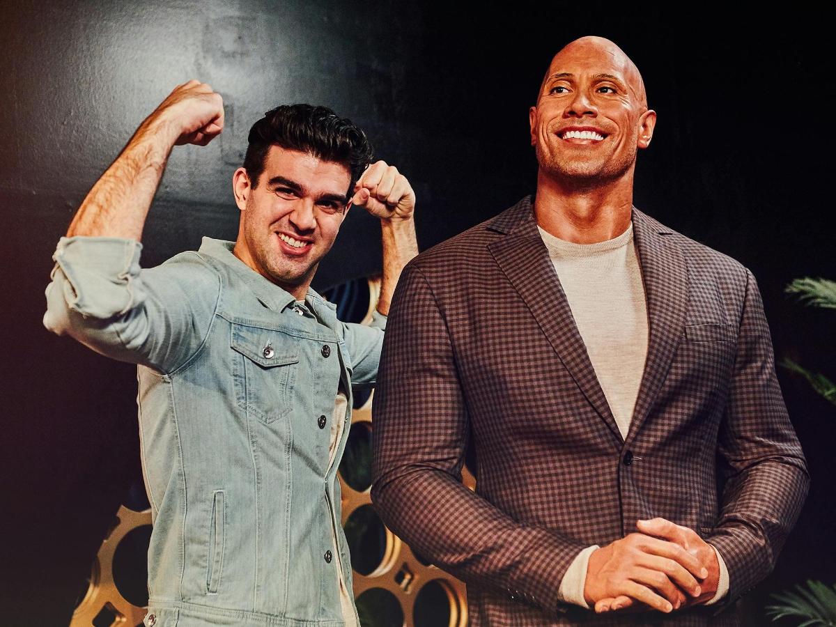two men are standing next to each other