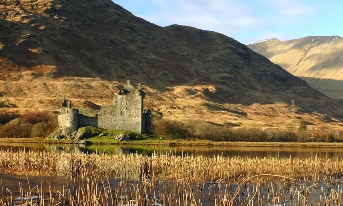 a castle on an island in a body of water