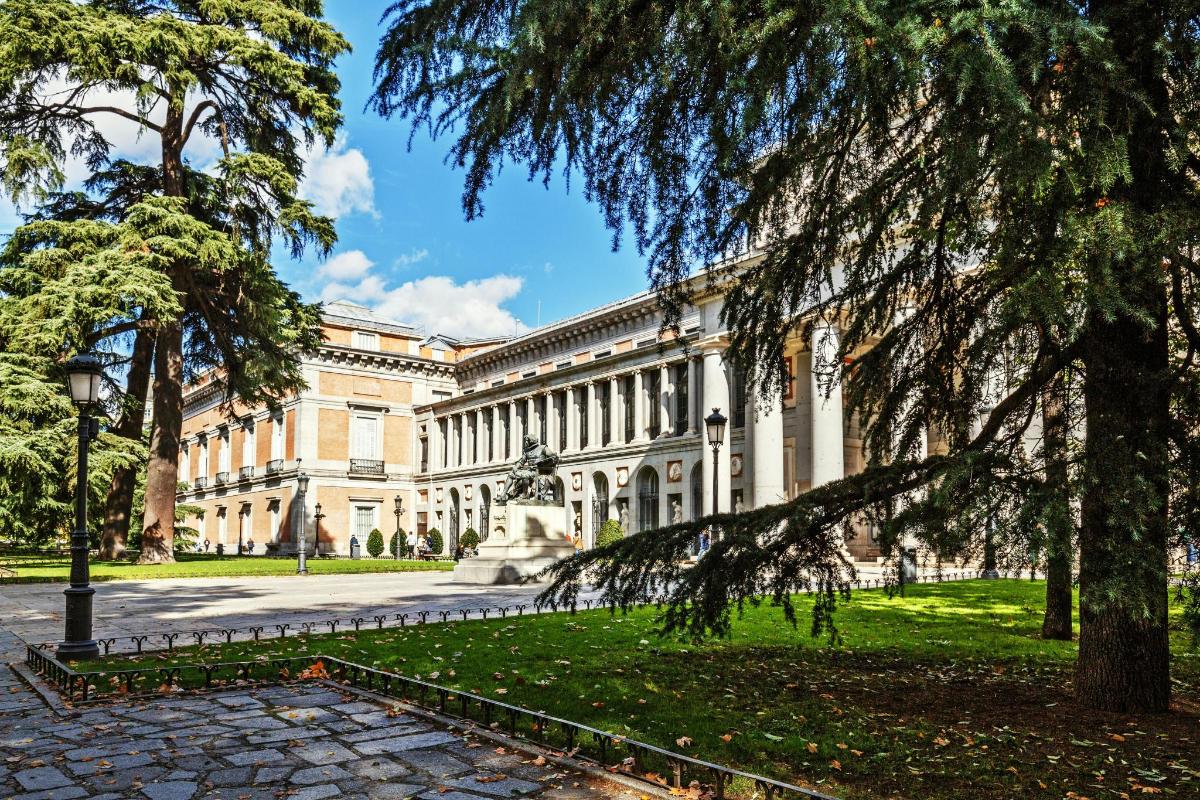 a large building with a tree in front of it