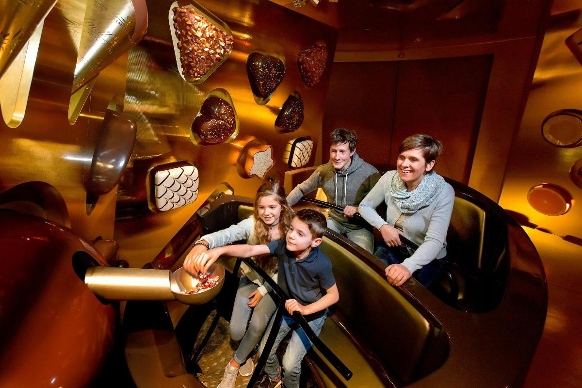 a group of people riding on a roller coaster