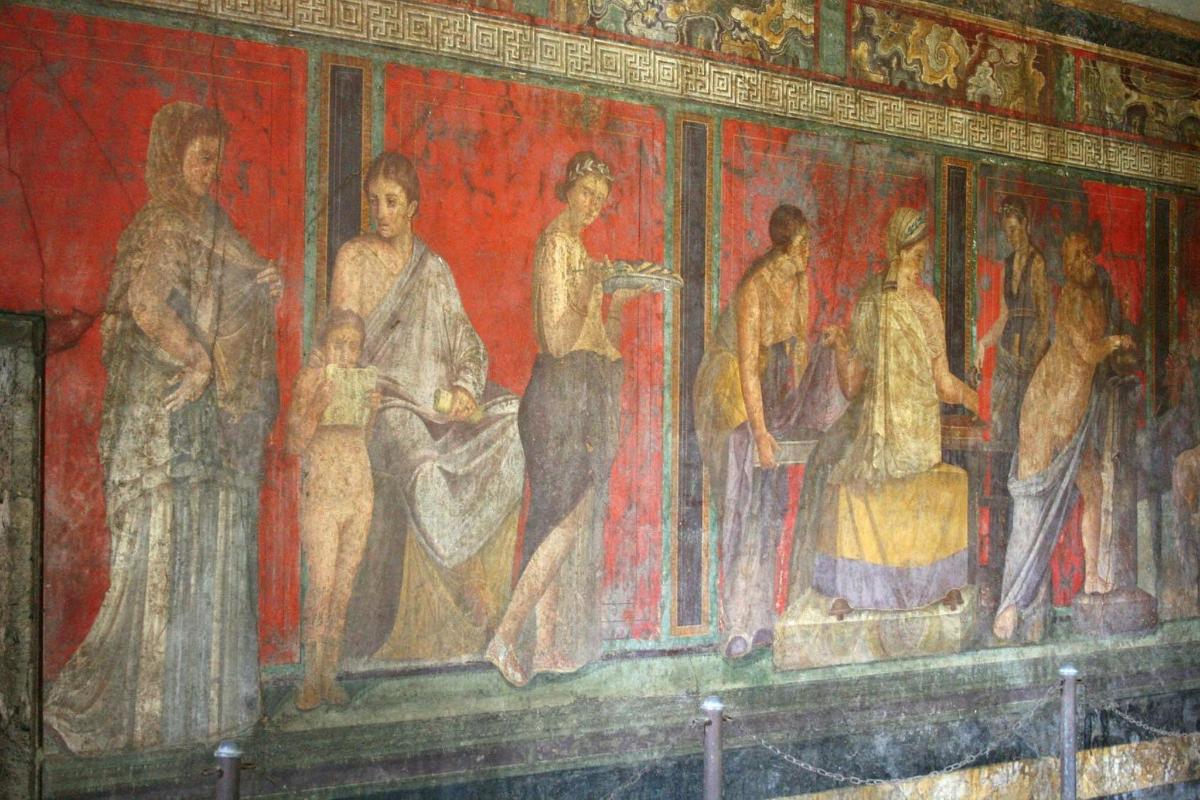 a painting of a group of people on a wall