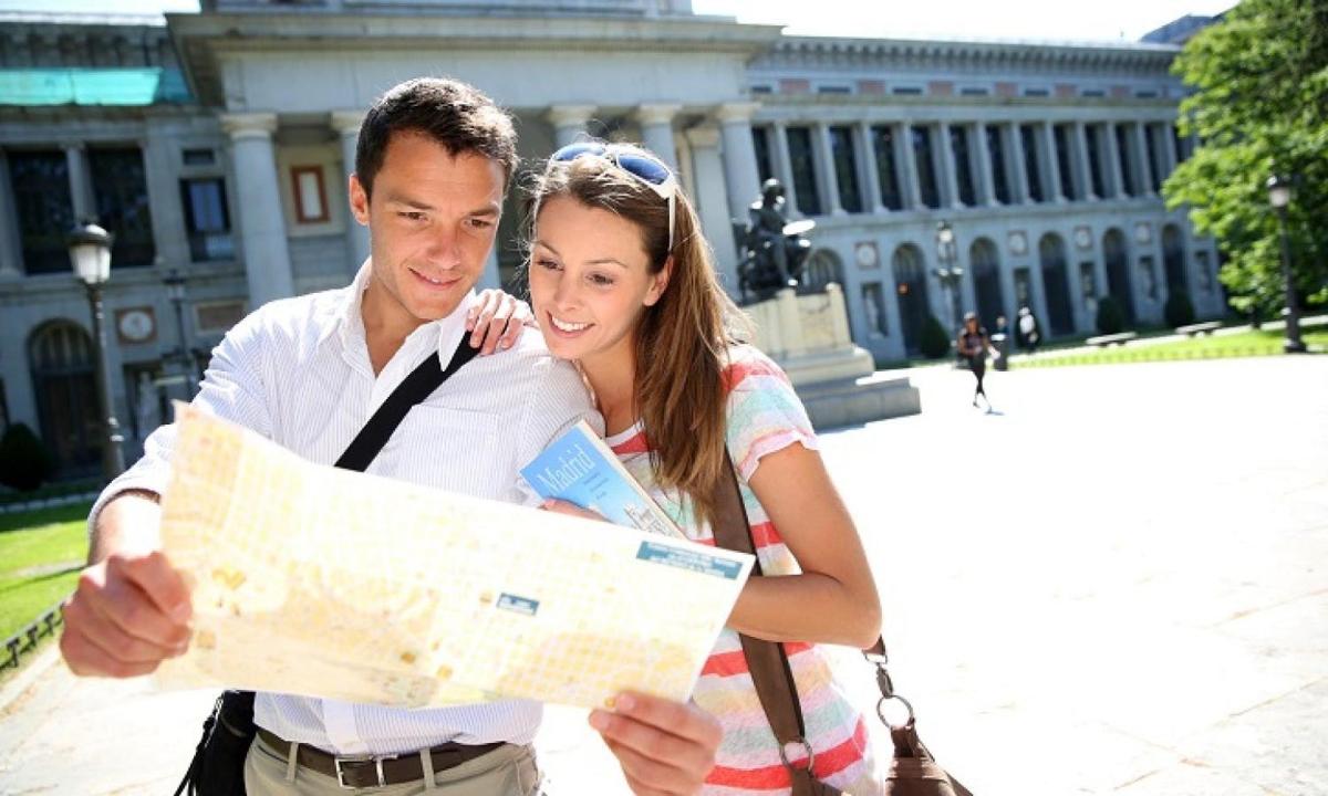 a man and a woman looking at a map