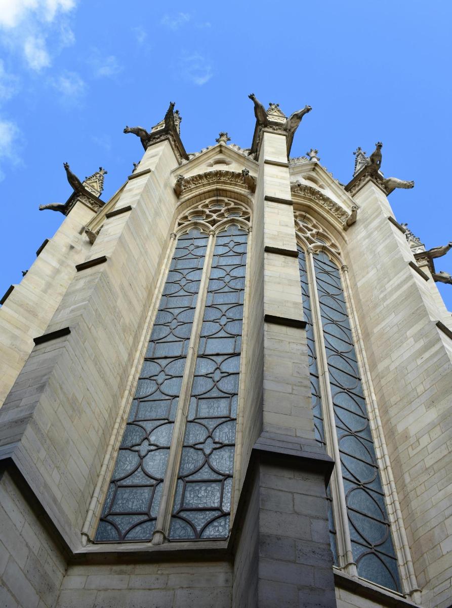 a tall building with large windows on top of it