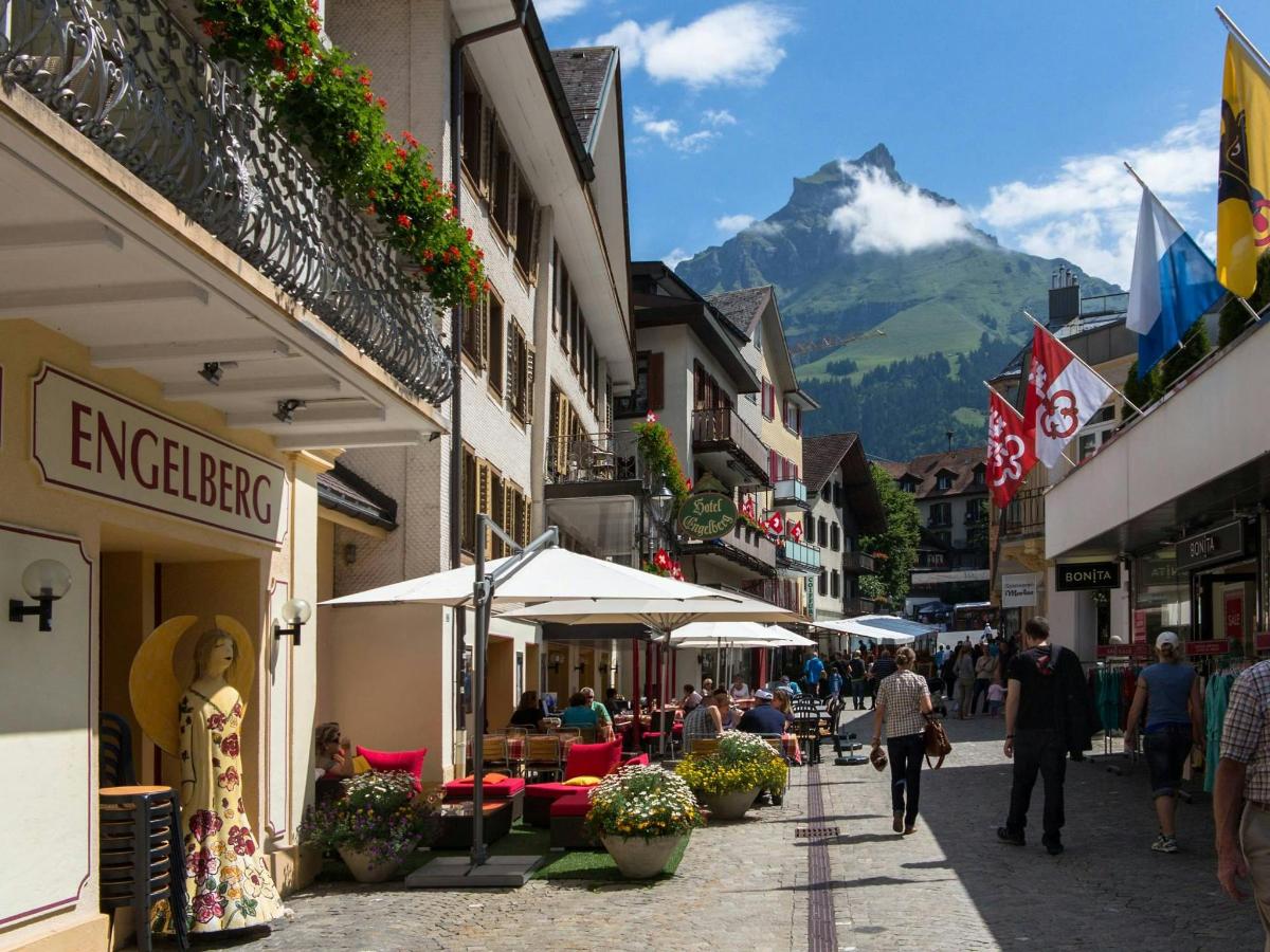 a street in a town with a mountain in the background