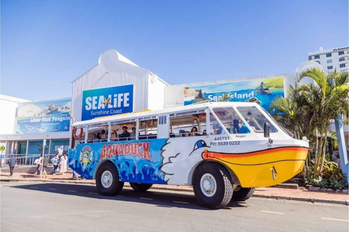 a bus painted like a boat is parked on the street