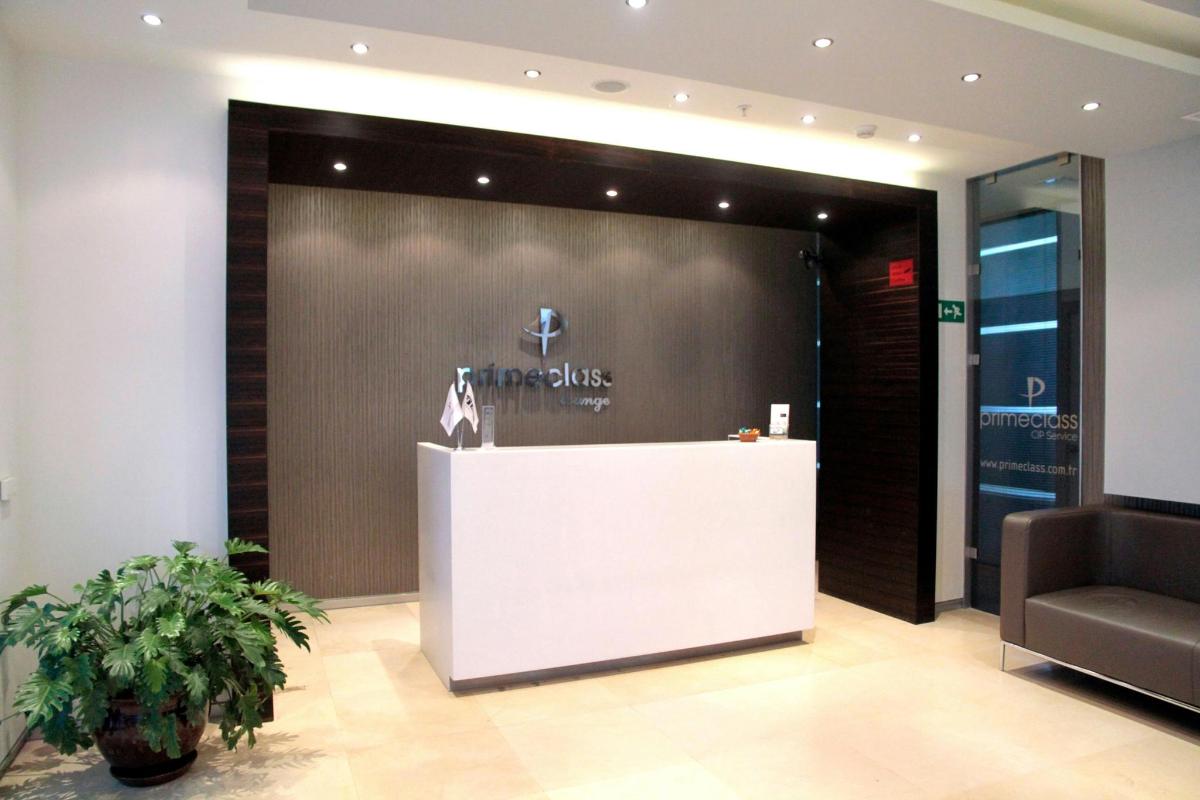 a store front with a white counter in a lobby