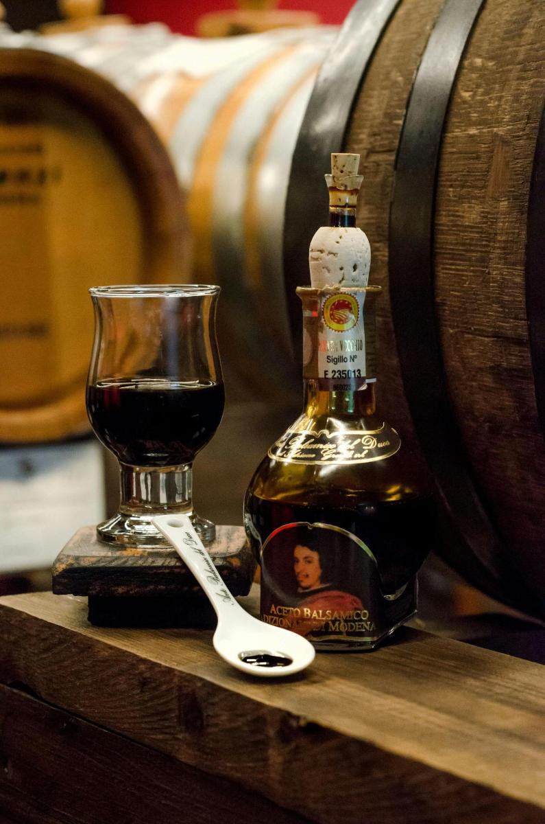 a bottle of wine and a glass on a table
