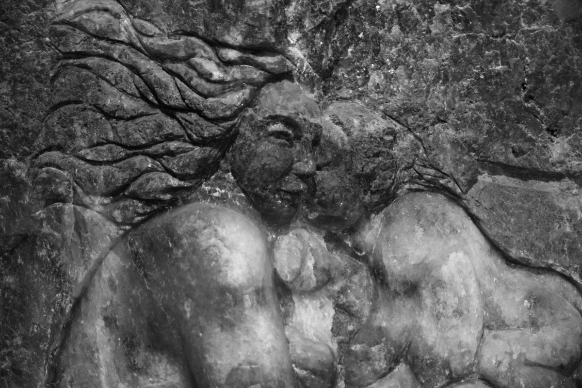 a bas relief of a statue of a man