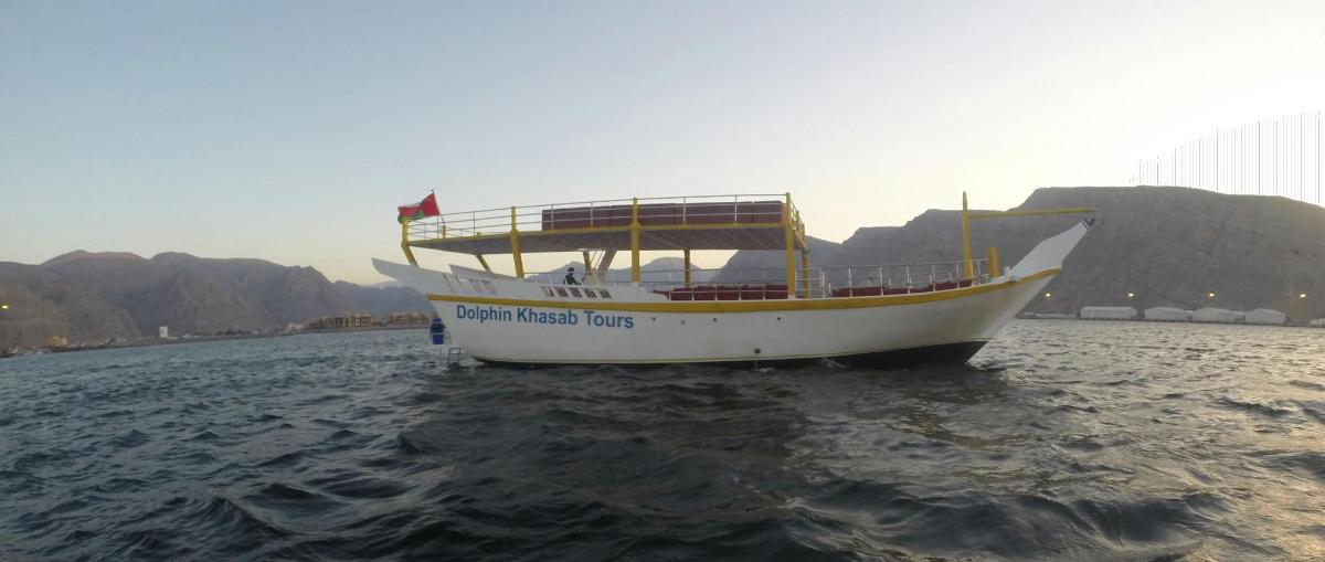 a boat in the water with a flag on it