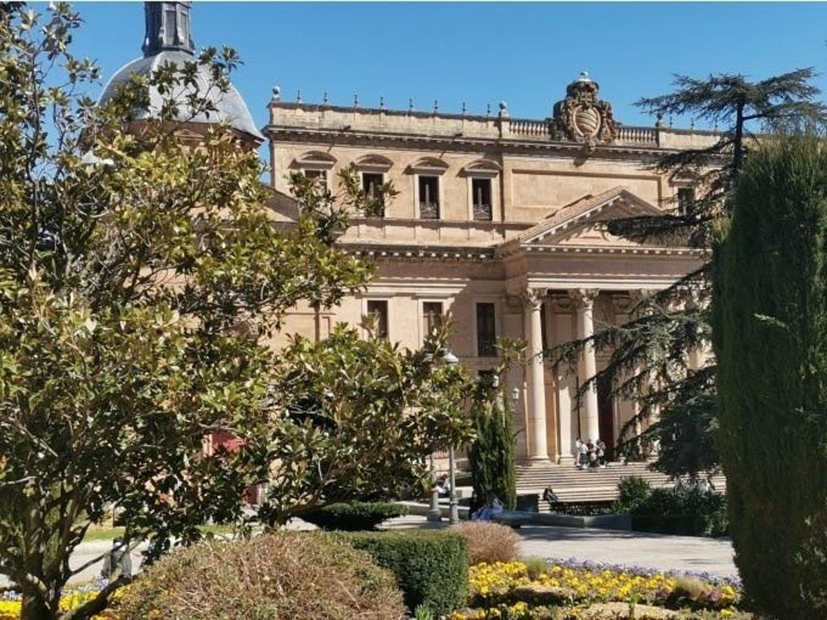 a large building with a statue on top of it