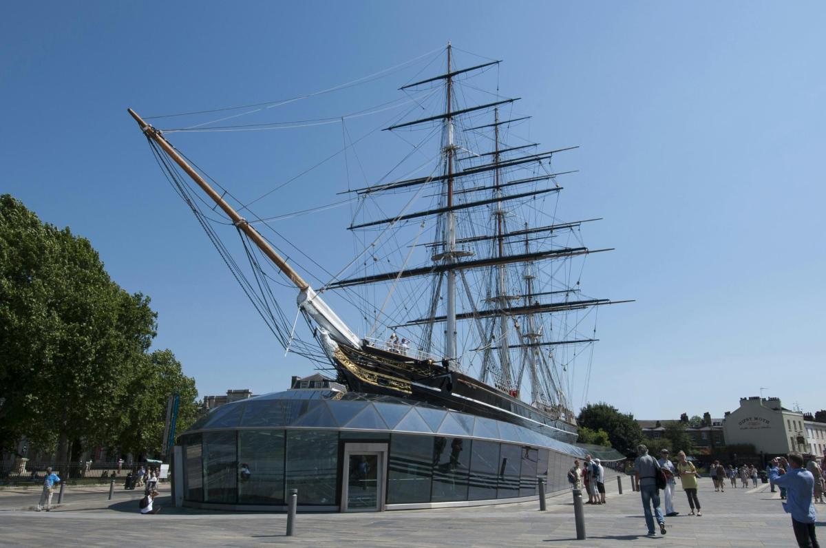 a tall ship sitting on top of a building