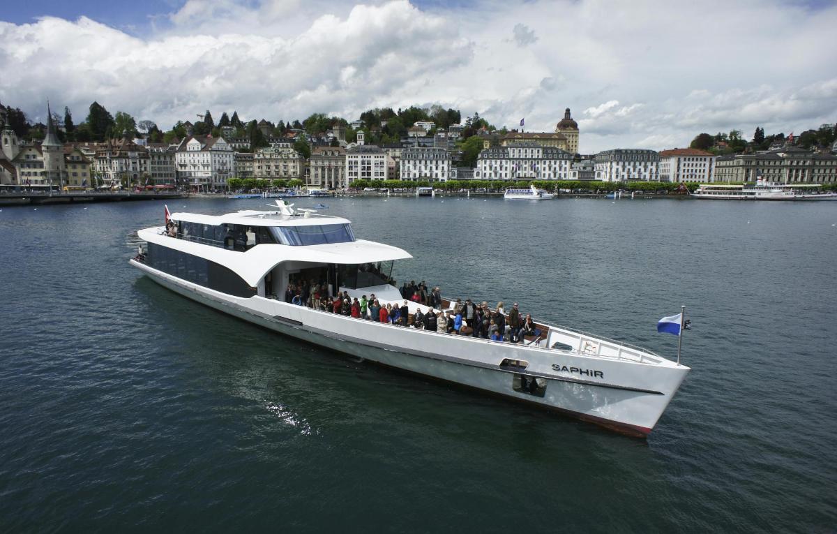 a boat with a group of people on it in the water