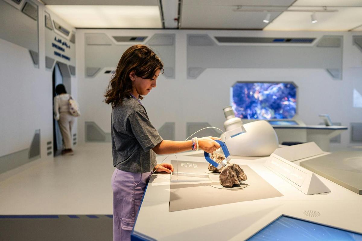 a young woman in a hospital room with a machine