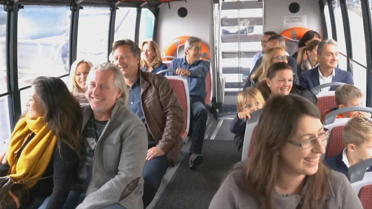 a group of people sitting on a bus