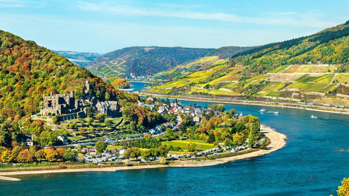 an aerial view of a town on the river