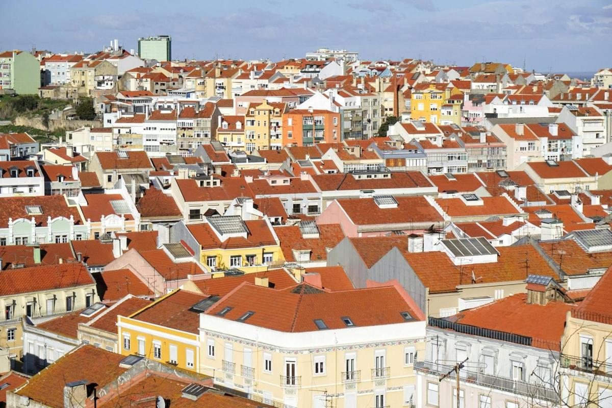 a view of a city with buildings and roofs