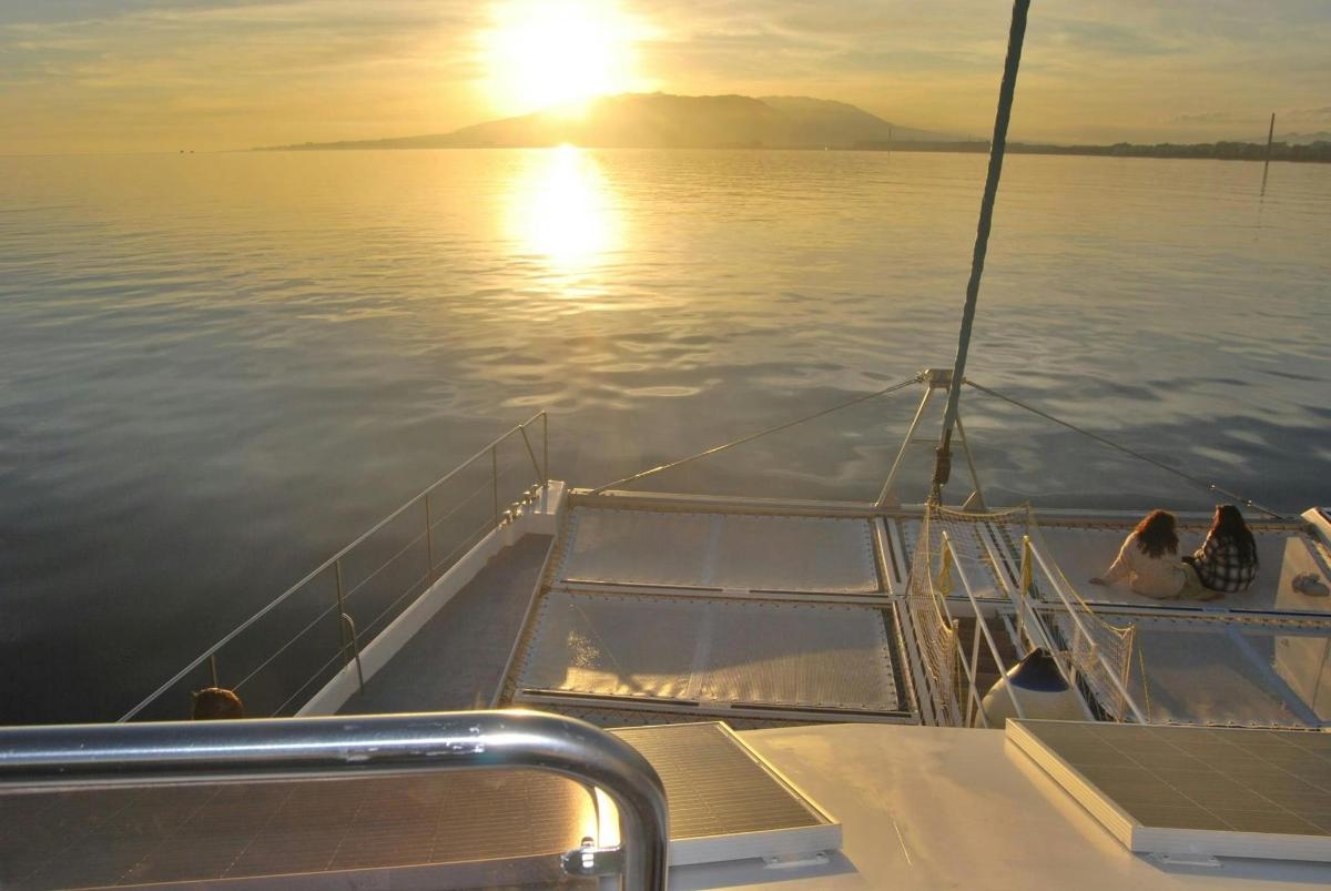 a boat in the water with two people on it