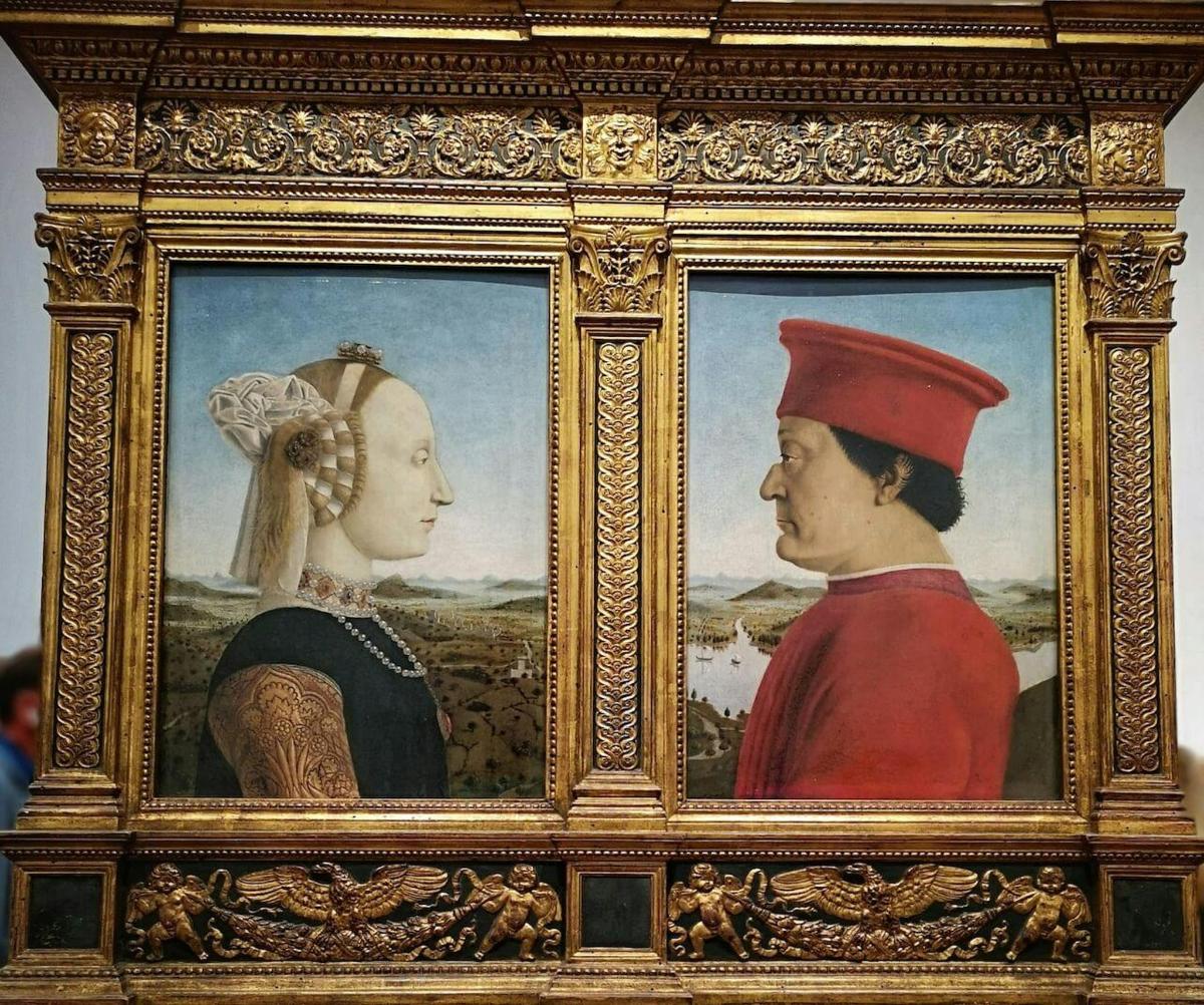 uma pintura emoldurada de um homem e uma mulher