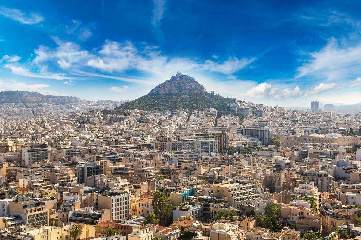a view of a city with a mountain in the background