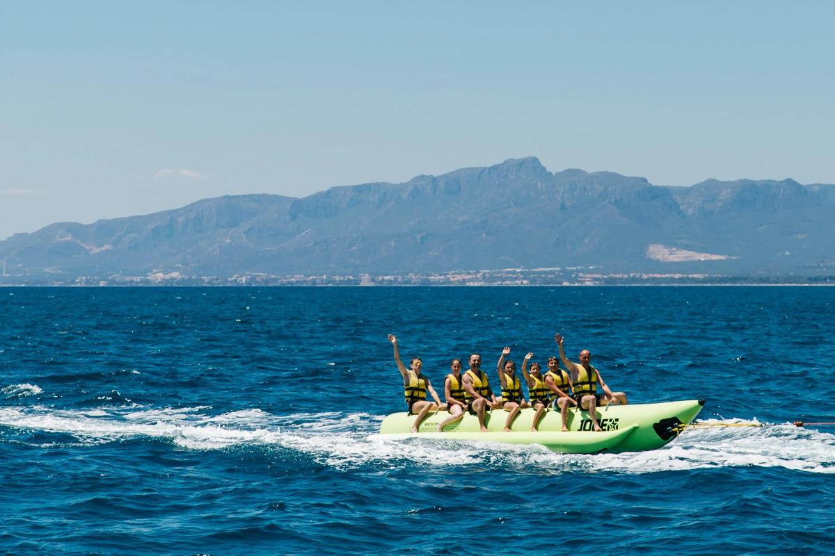 a group of people on a boat in the water