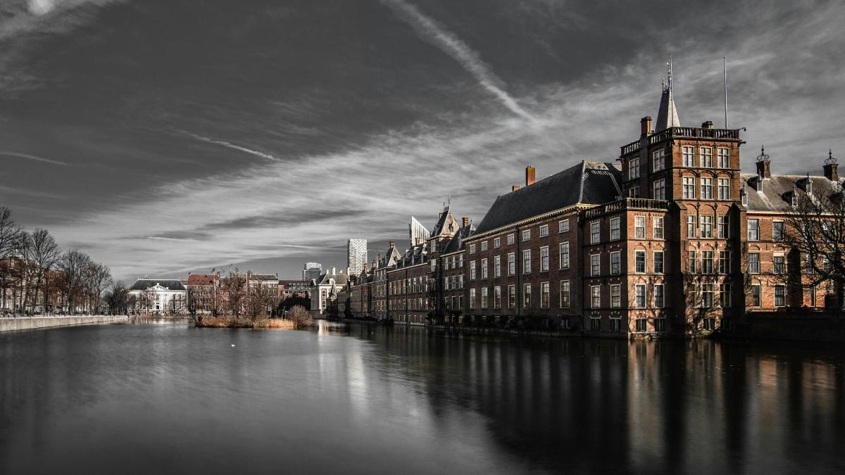 a view of a river with buildings and a bridge