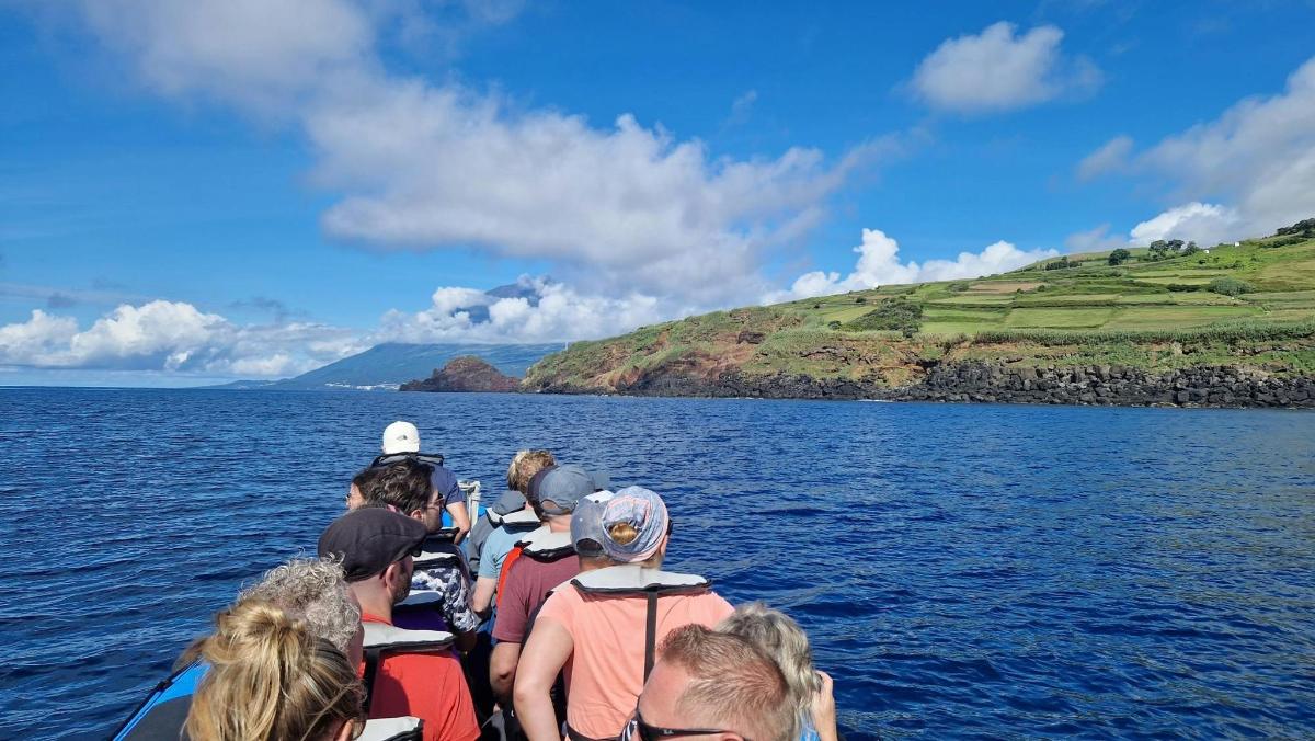 a group of people on a boat in the water