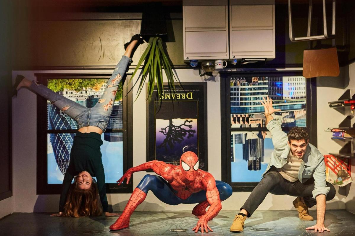 a group of actors in a performance of spider man
