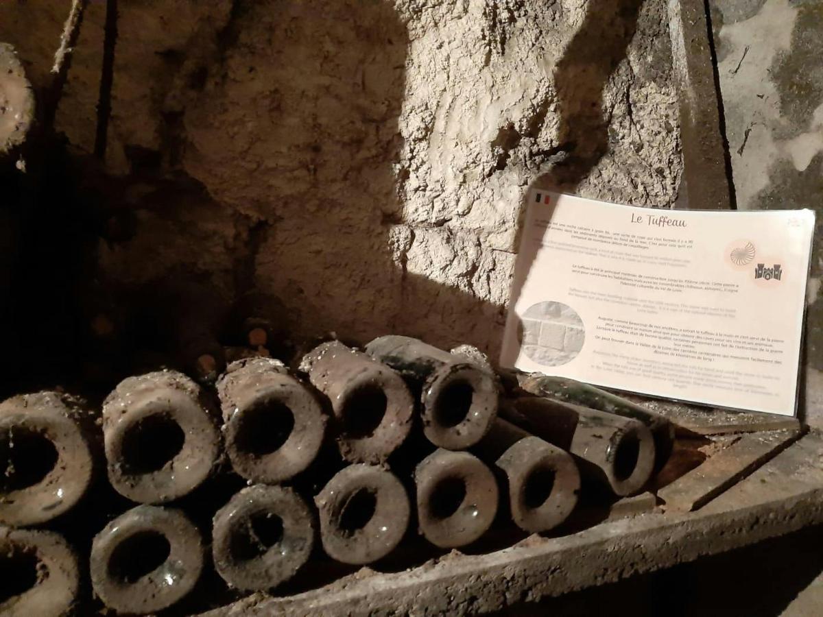 a pile of rubber pipes sitting next to a wall