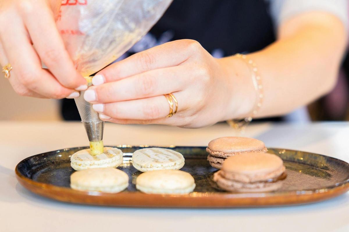 a woman is preparing food on a plate
