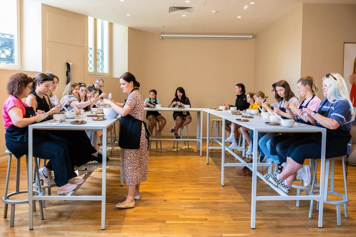 a group of people sitting at tables in a room