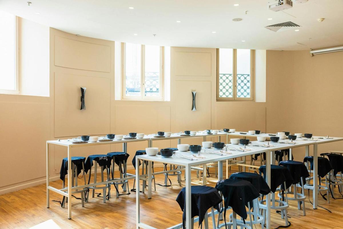 a large room with a long table and chairs