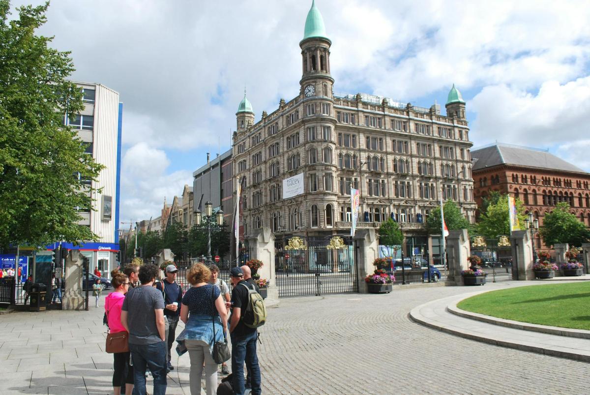 a group of people standing in front of a building