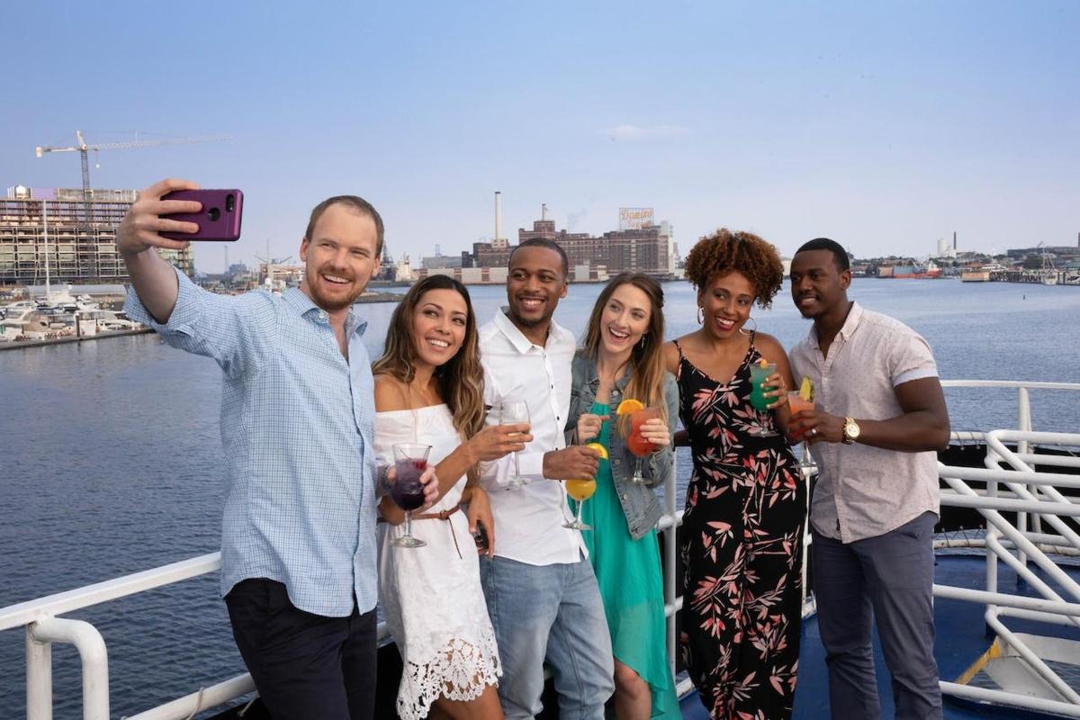 a group of people posing for a picture on a boat