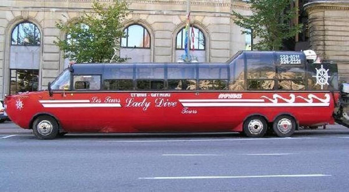 a red bus parked on the side of a street