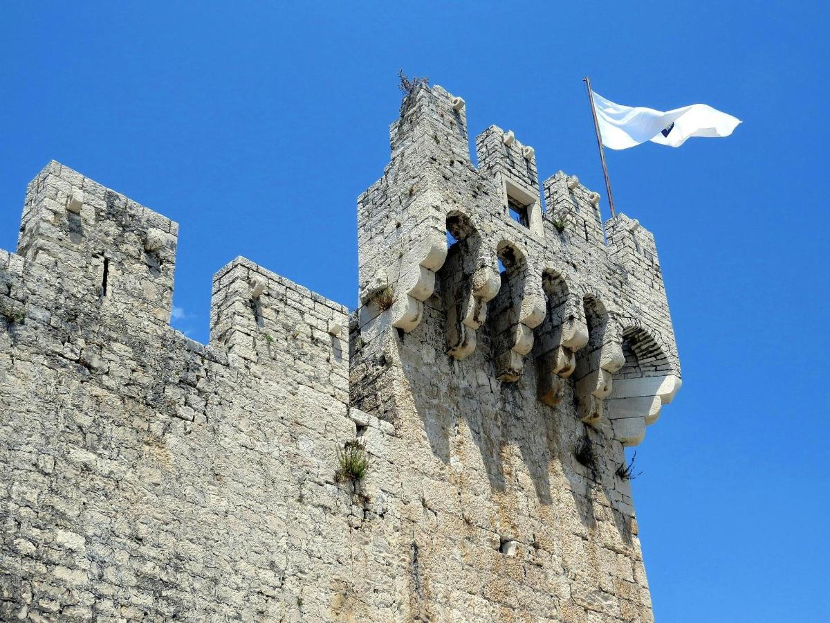 a white flag flying on top of a castle