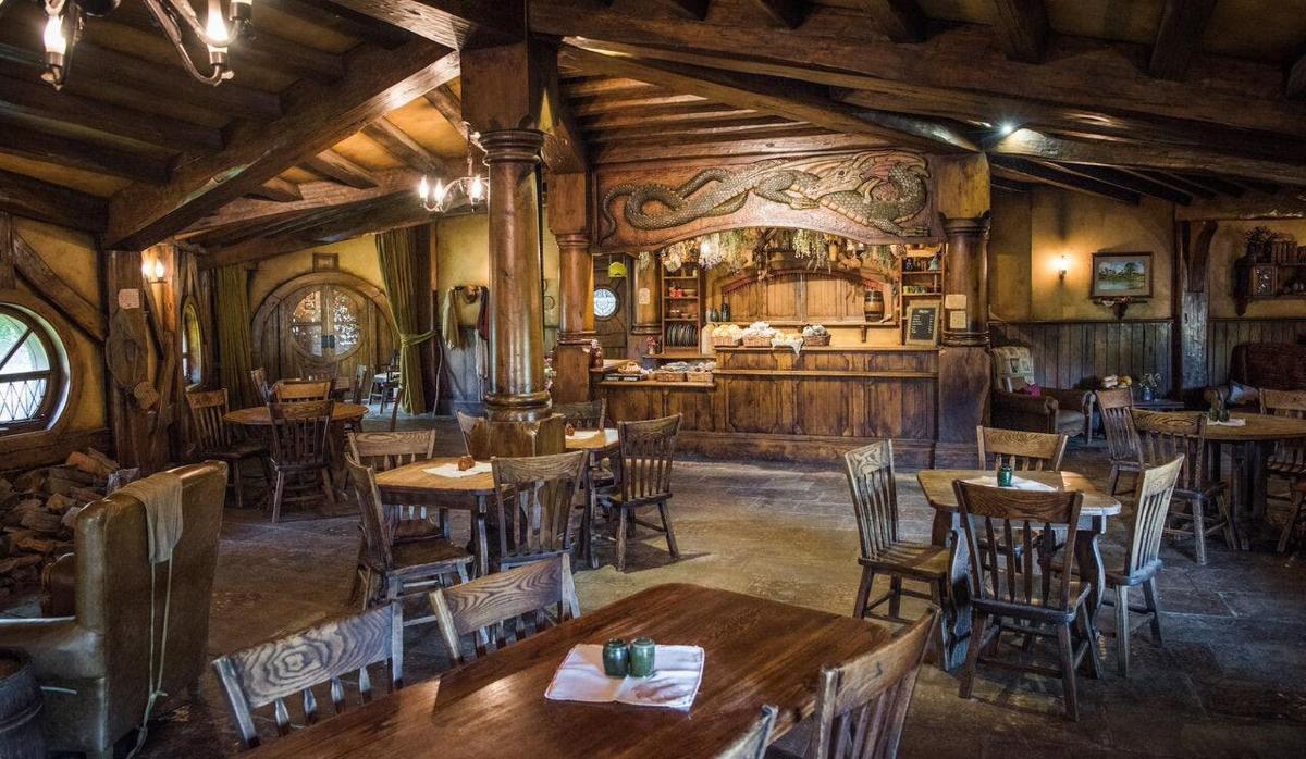 a restaurant with wooden tables and chairs in a room