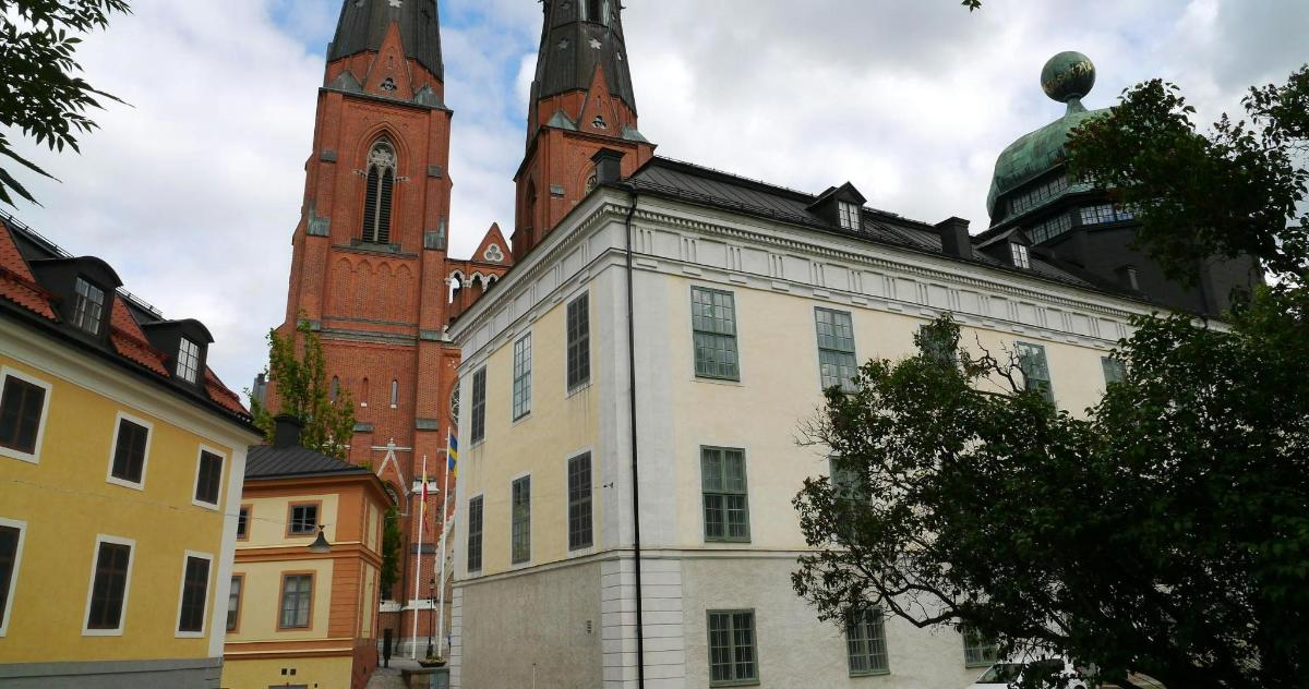 an old building with two towers in a city