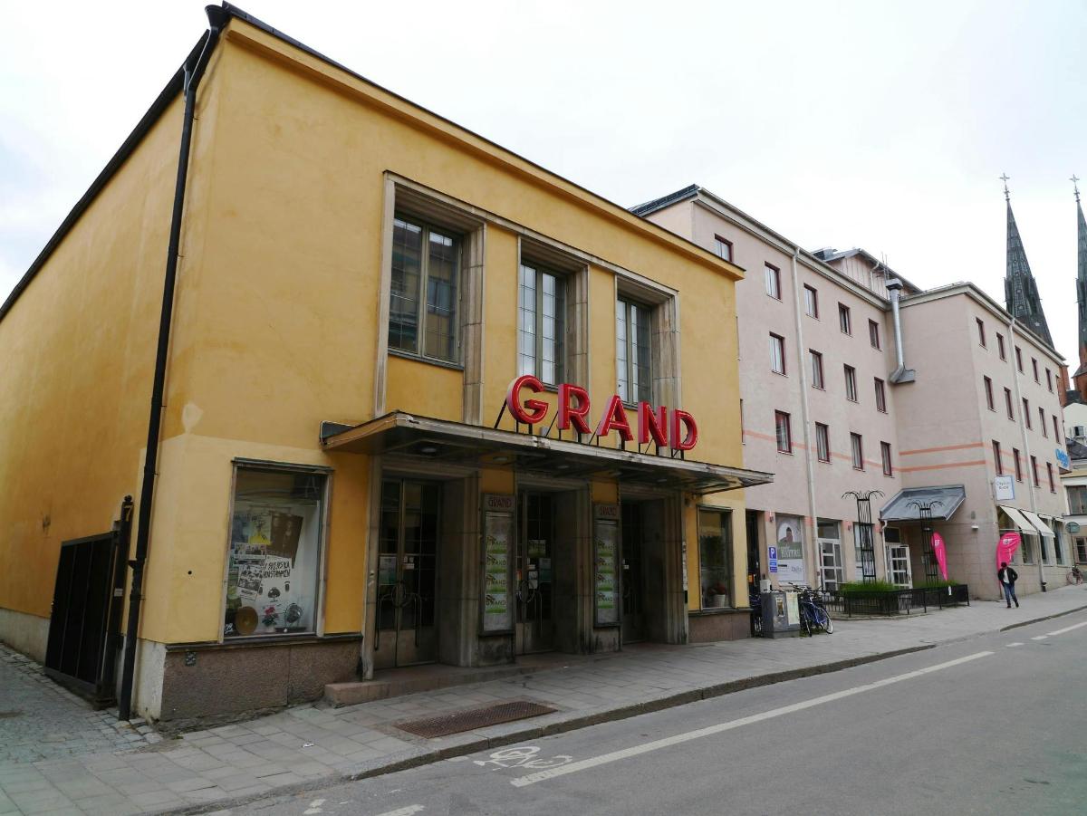 a grand store on the side of a street