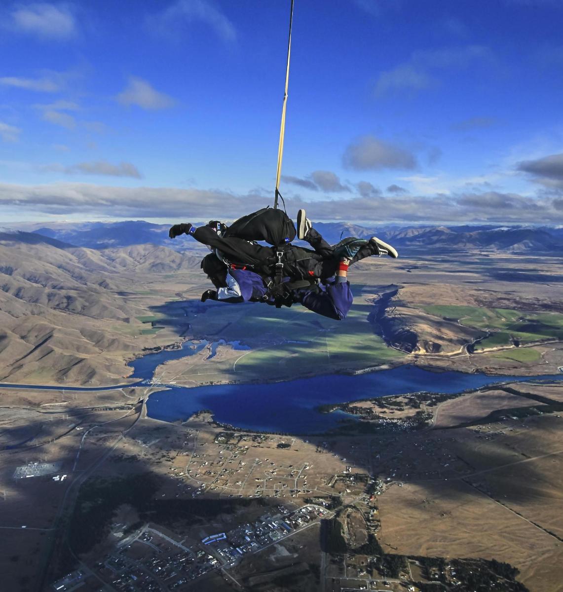 a person hanging from a rope in the air