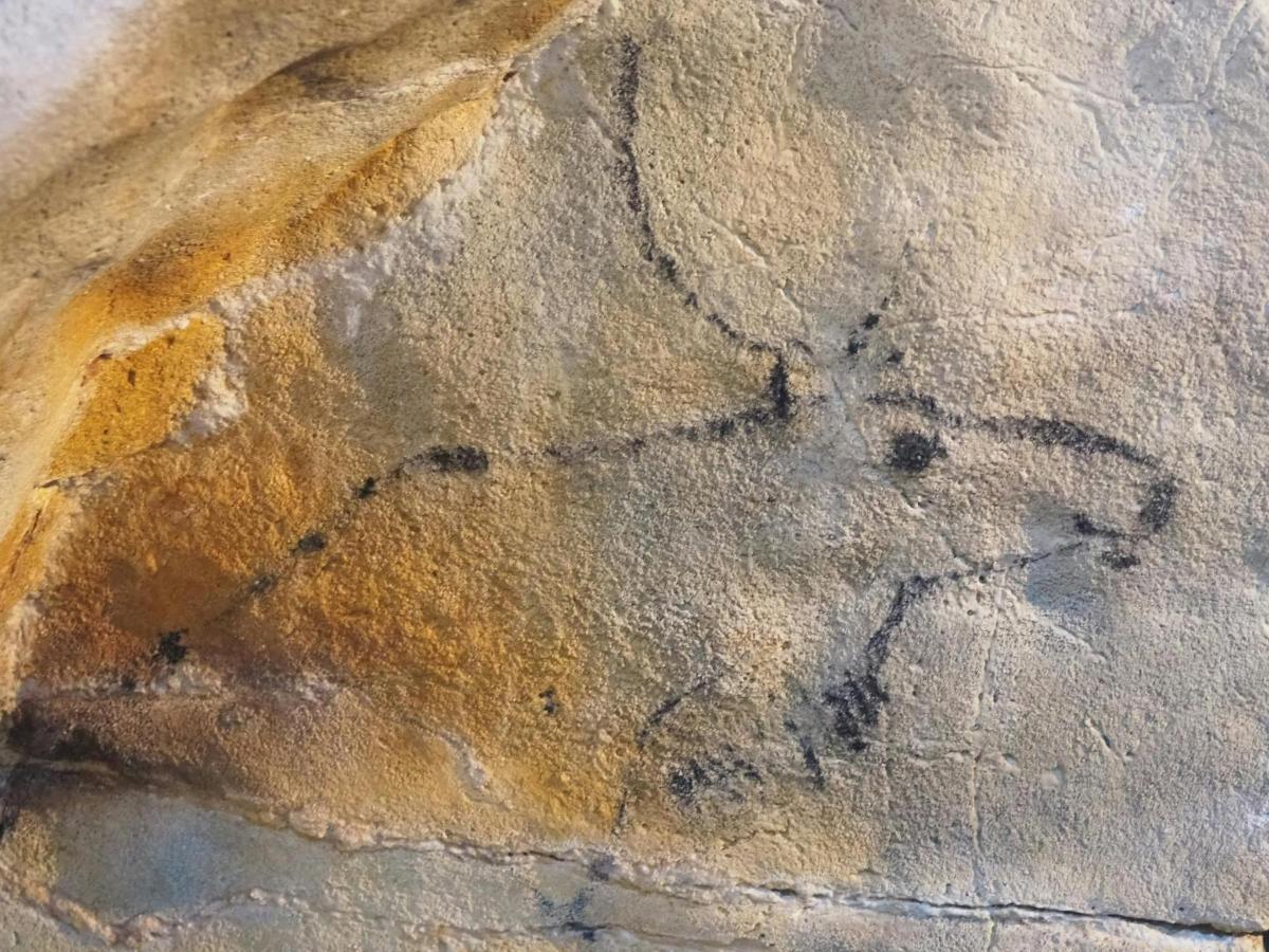 a rock with a painting of a horse on it