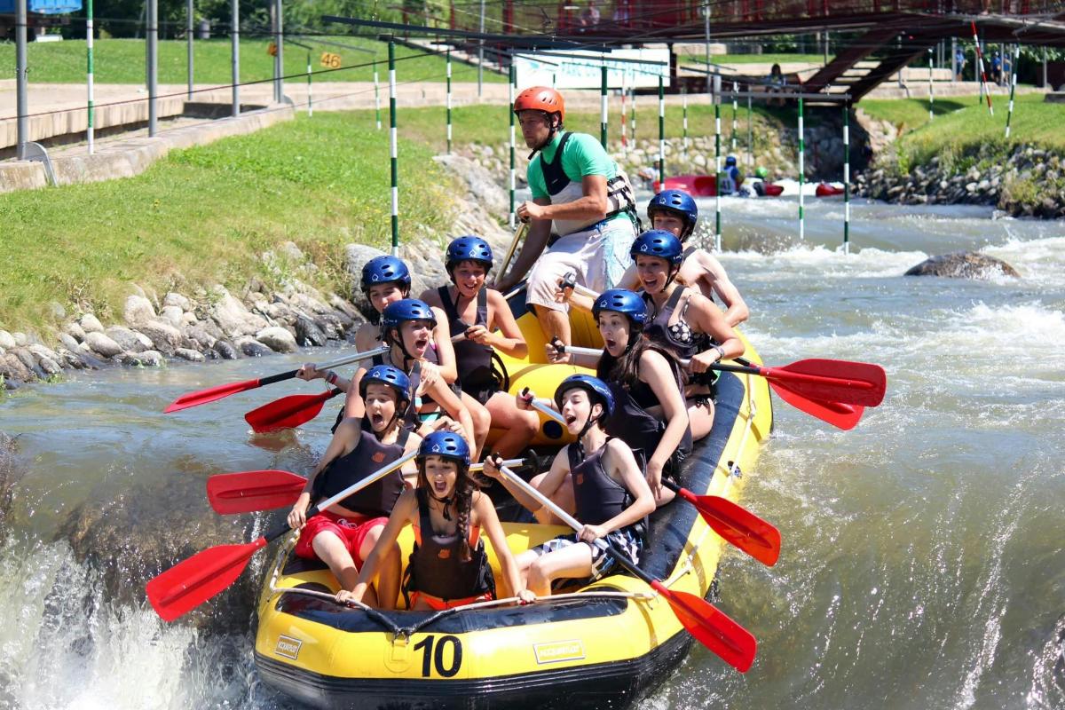 a group of people on a raft in the water