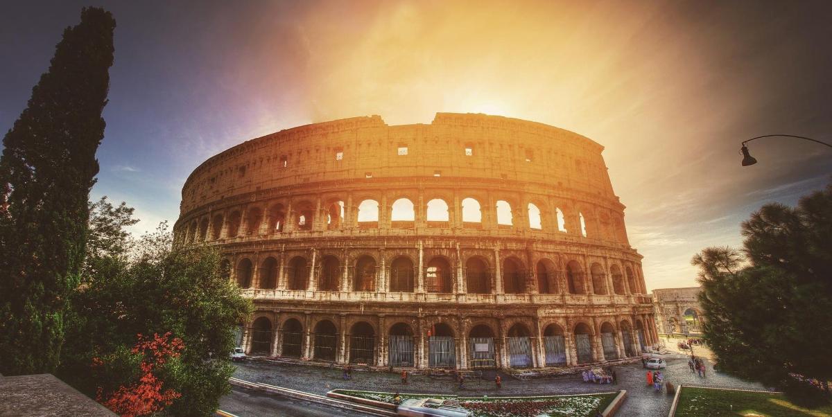 a large elliptical building with theleaning tower