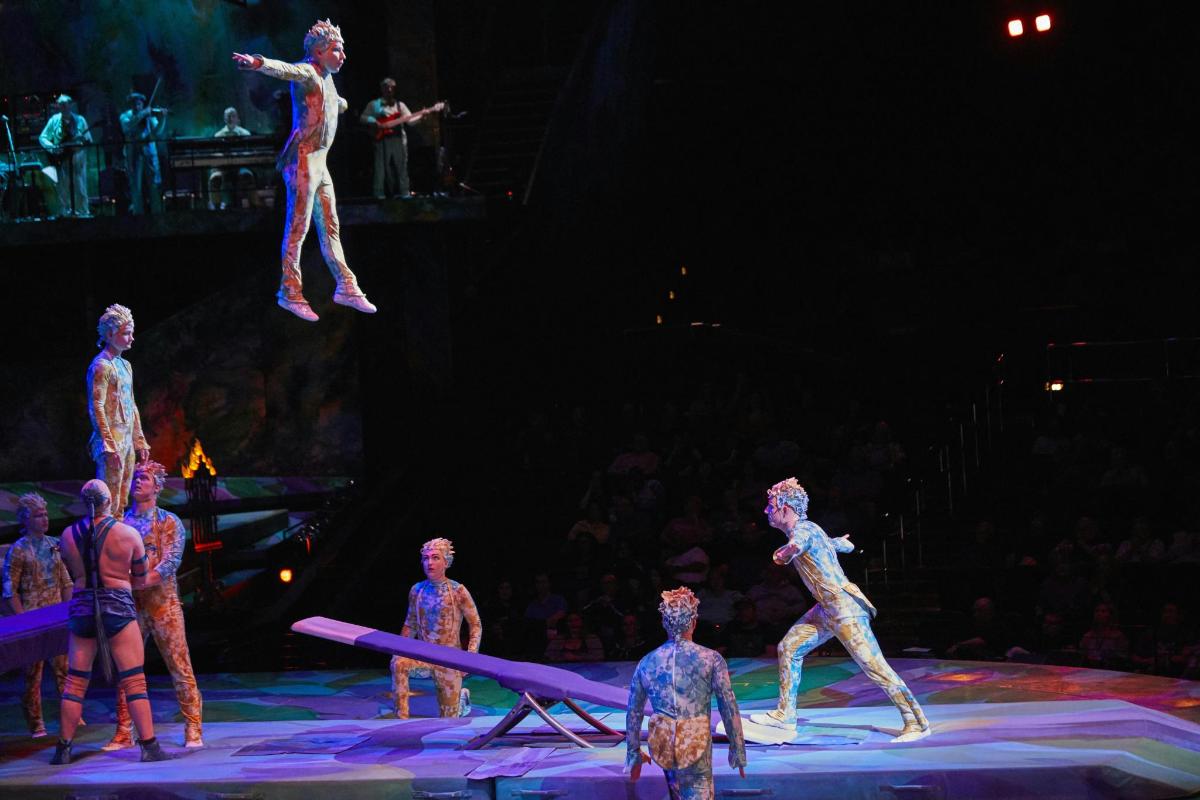 a group of performers on stage in a show