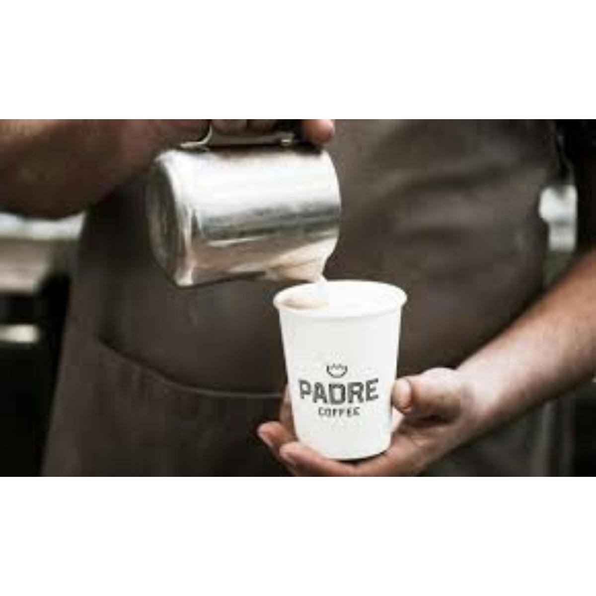 a person is holding a cup of coffee